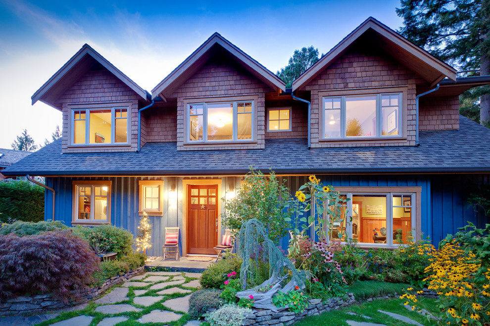 Design ideas for a traditional two floor house exterior in Vancouver.