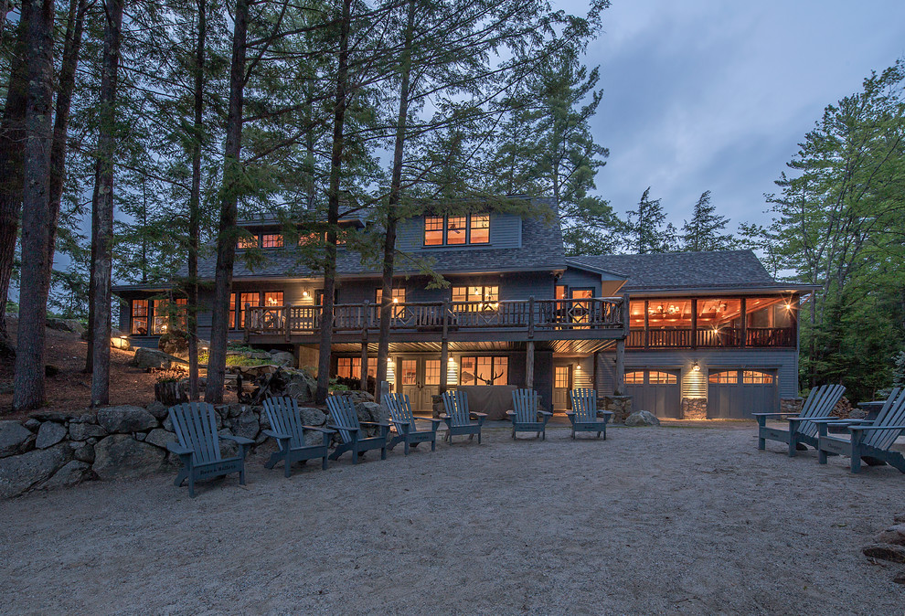 Inspiration for a large rustic blue three-story mixed siding exterior home remodel in Burlington with a hip roof