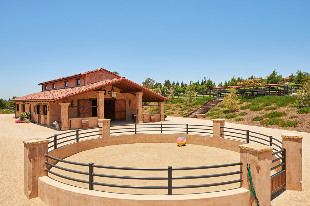 Huge mediterranean beige one-story stucco exterior home idea in Santa Barbara