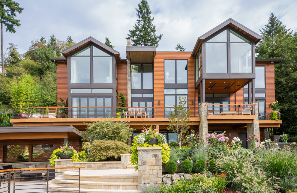 This is an example of a large contemporary detached house in Seattle with three floors and mixed cladding.