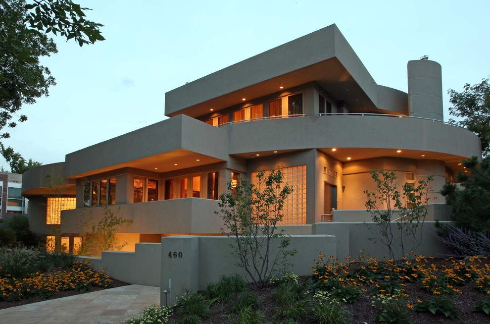 Inspiration for a contemporary house exterior in Denver with three floors.