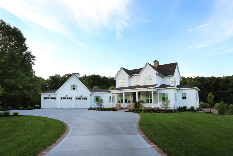 Inspiration for a large farmhouse white two-story concrete fiberboard exterior home remodel in Grand Rapids with a shingle roof