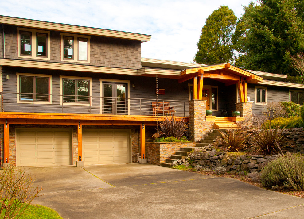 Inspiration for a large craftsman gray two-story mixed siding gable roof remodel in Seattle