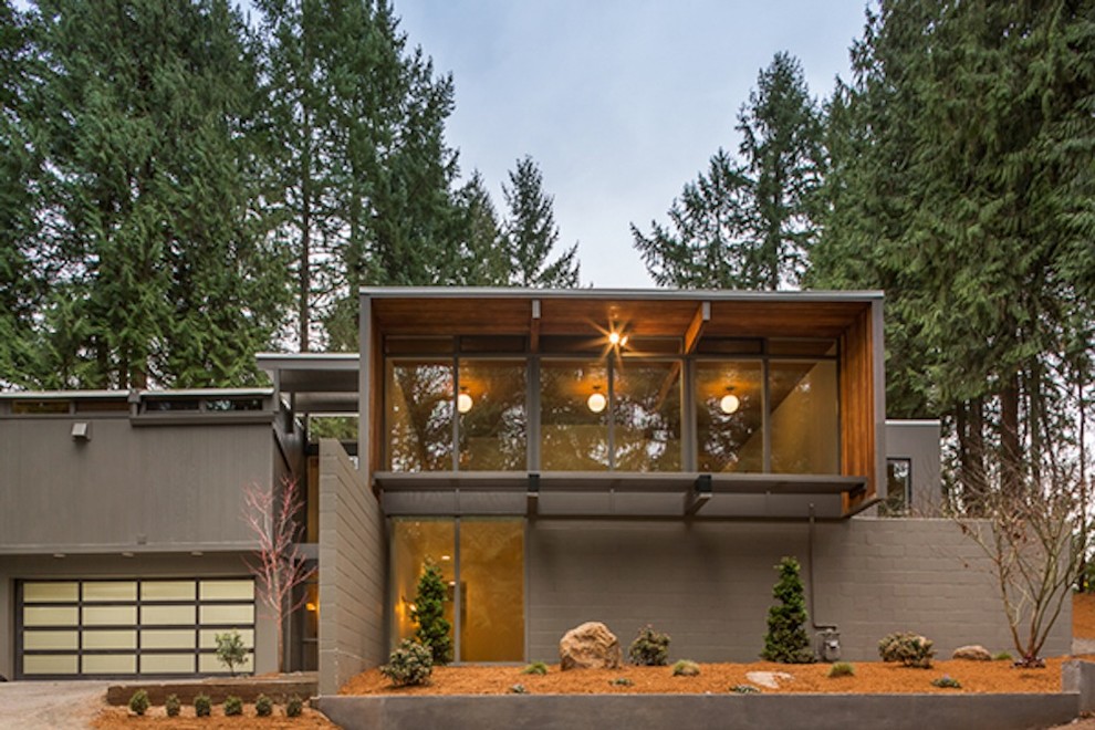 Inspiration for a mid-sized mid-century modern gray two-story concrete exterior home remodel in Portland