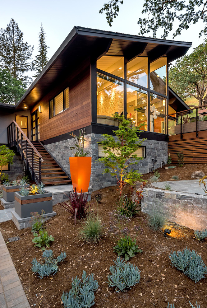 Large mid-century modern gray two-story mixed siding exterior home photo in San Francisco with a shingle roof