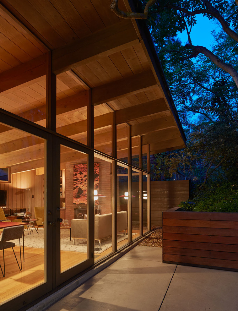 Inspiration for a small and brown retro two floor house exterior in San Francisco with wood cladding.
