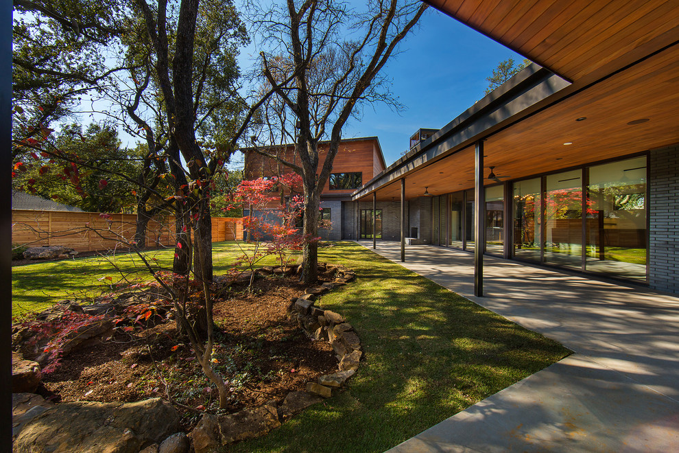 Mid-sized 1960s gray two-story mixed siding house exterior idea in Dallas with a metal roof