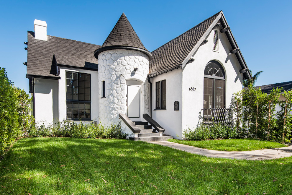 Example of a large classic white one-story exterior home design in Los Angeles with a shingle roof and a gray roof