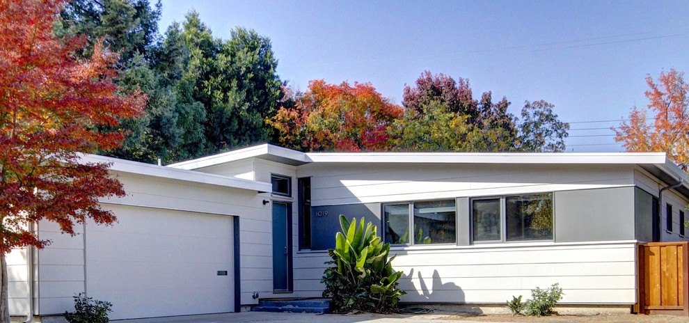 Inspiration for a small mid-century modern concrete fiberboard exterior home remodel in San Francisco