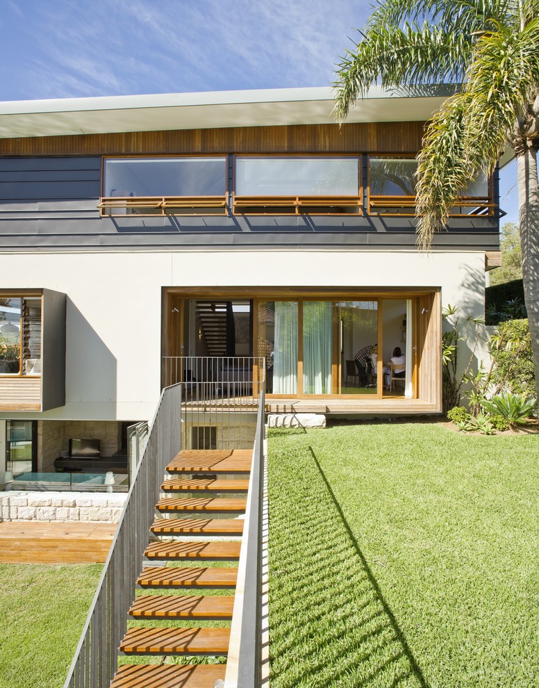 Large contemporary two floor house exterior in Sydney with mixed cladding and a lean-to roof.