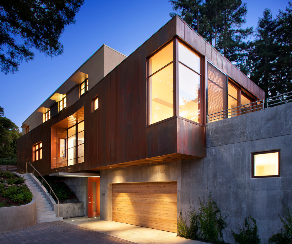 This is an example of a medium sized and brown modern house exterior in San Francisco with three floors.