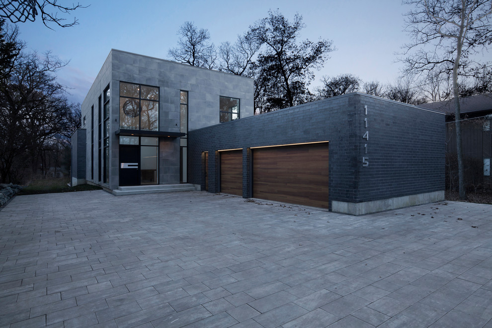 Mid-sized modern gray two-story concrete exterior home idea in Chicago