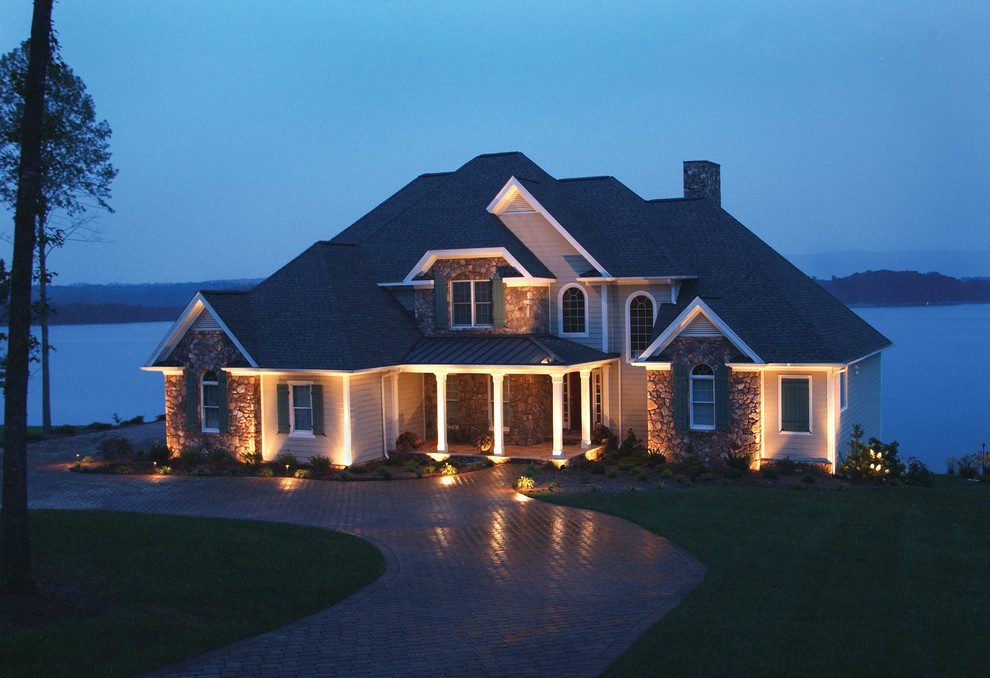 Photo of a large and gey classic two floor house exterior in Minneapolis with mixed cladding.