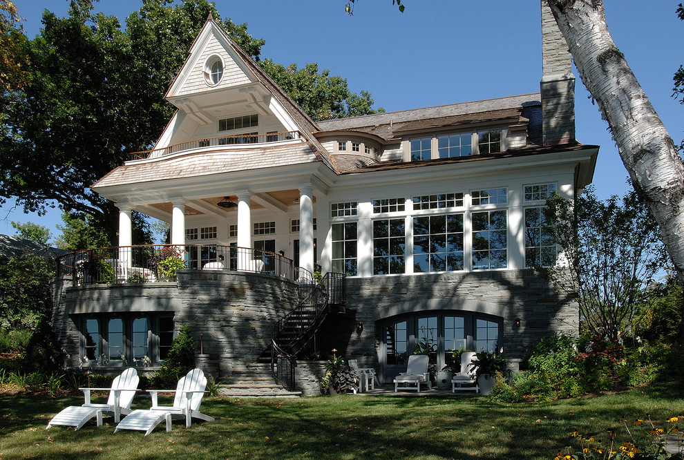 This is an example of a medium sized victorian two floor house exterior in Minneapolis with wood cladding.