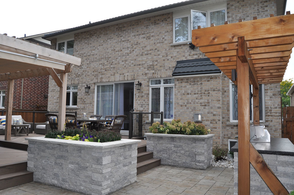 Mississauga Rd Paver Patio with Stone Planters Transitional