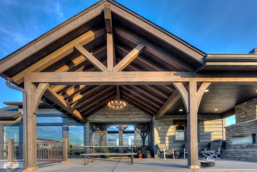 Inspiration for a rustic gray concrete gable roof remodel in Other