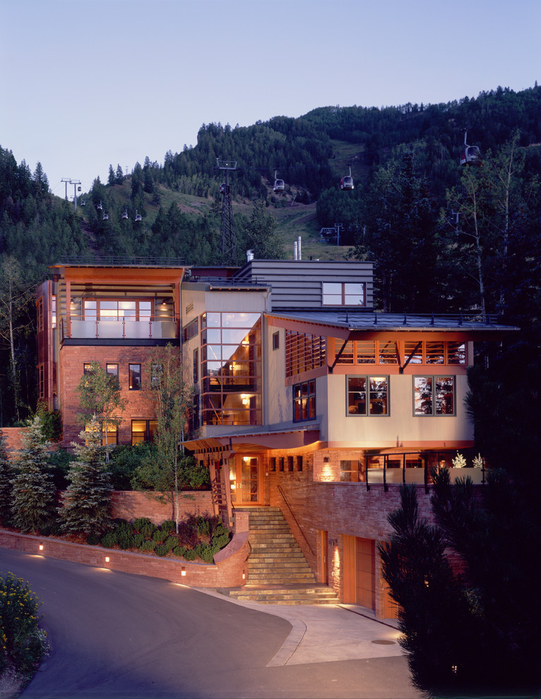 Large trendy beige two-story mixed siding house exterior photo in Denver