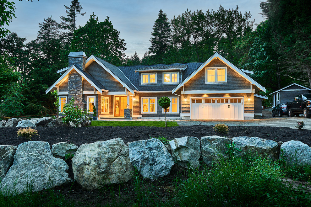 Example of a mid-sized transitional gray two-story wood exterior home design in Vancouver with a shingle roof