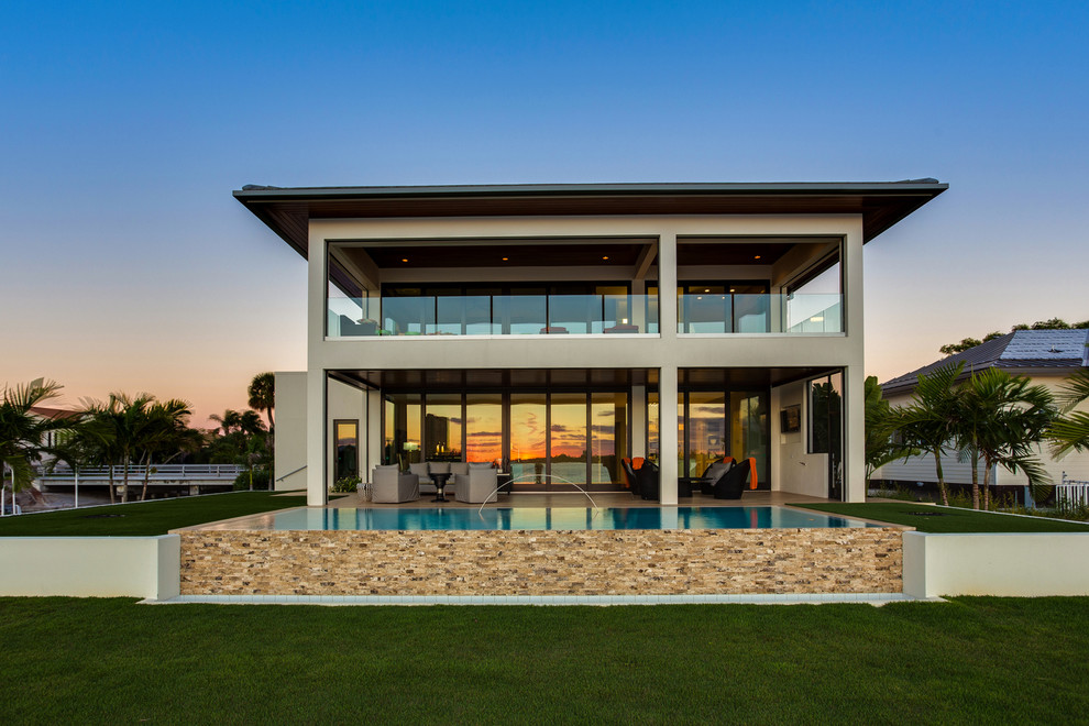 Design ideas for a world-inspired house exterior in Tampa.
