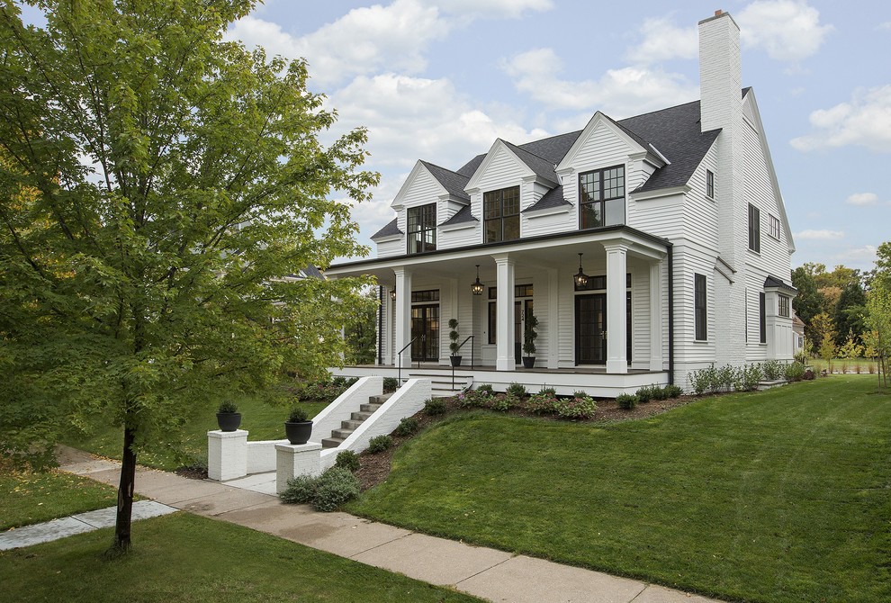 Inspiration for a white traditional two floor house exterior in Minneapolis.