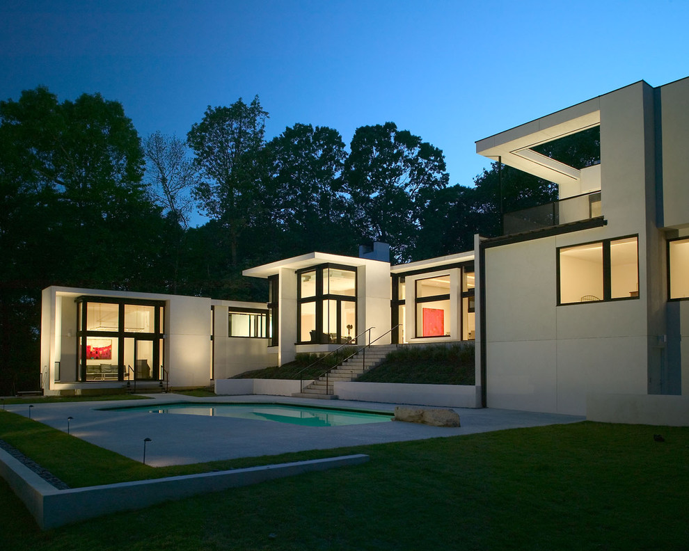 Photo of a white modern bungalow house exterior in Atlanta.