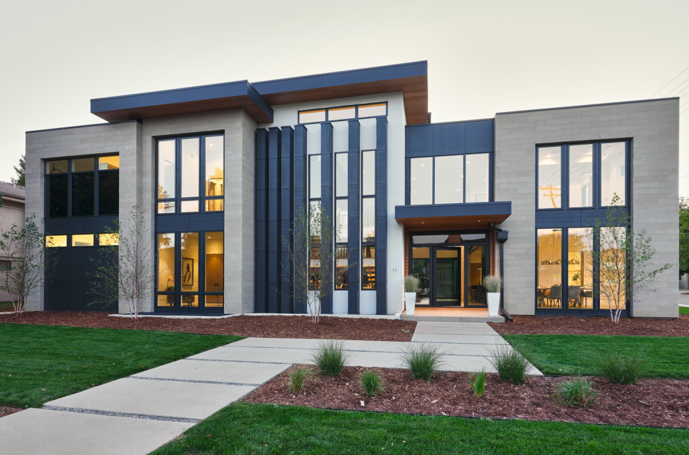 Zweistöckiges Modernes Einfamilienhaus mit Steinfassade, grauer Fassadenfarbe und Flachdach in Denver