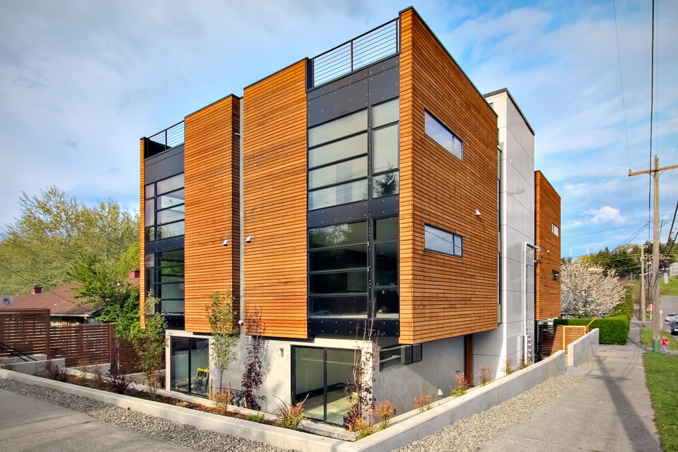 Diseño de fachada de piso moderna con revestimiento de madera
