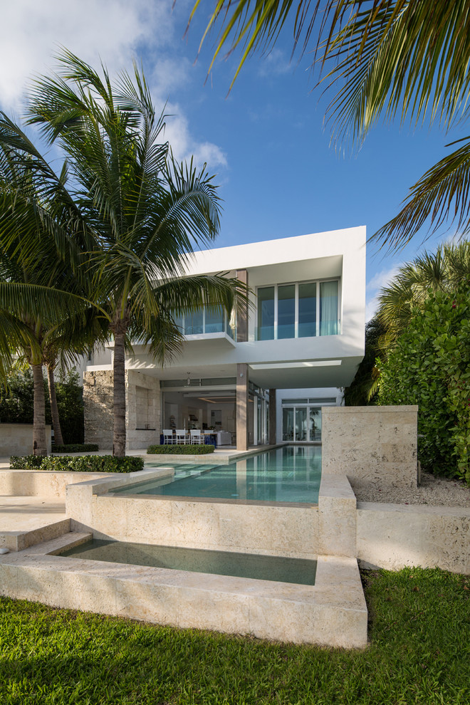 This is an example of a modern two floor house exterior in Miami.