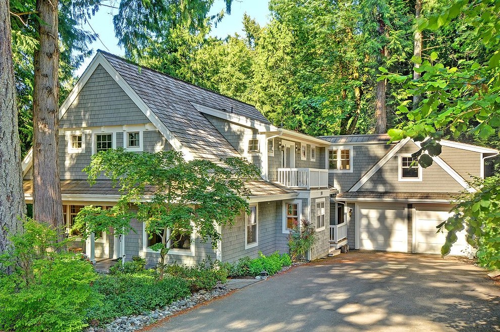 Large farmhouse gray two-story wood exterior home photo in Seattle