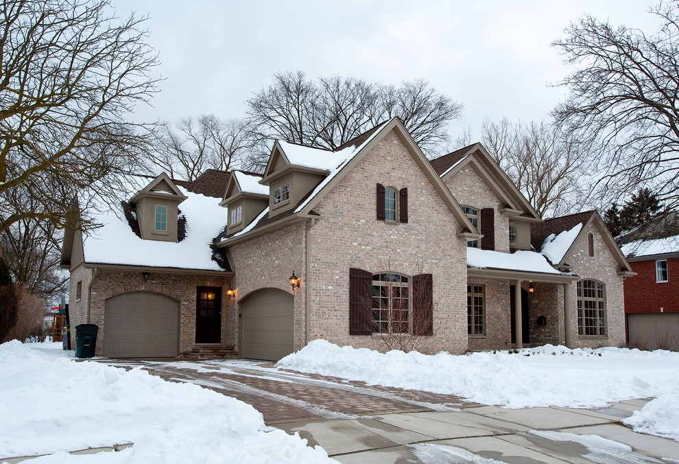 Inspiration for a timeless multicolored two-story brick exterior home remodel in Chicago with a shingle roof