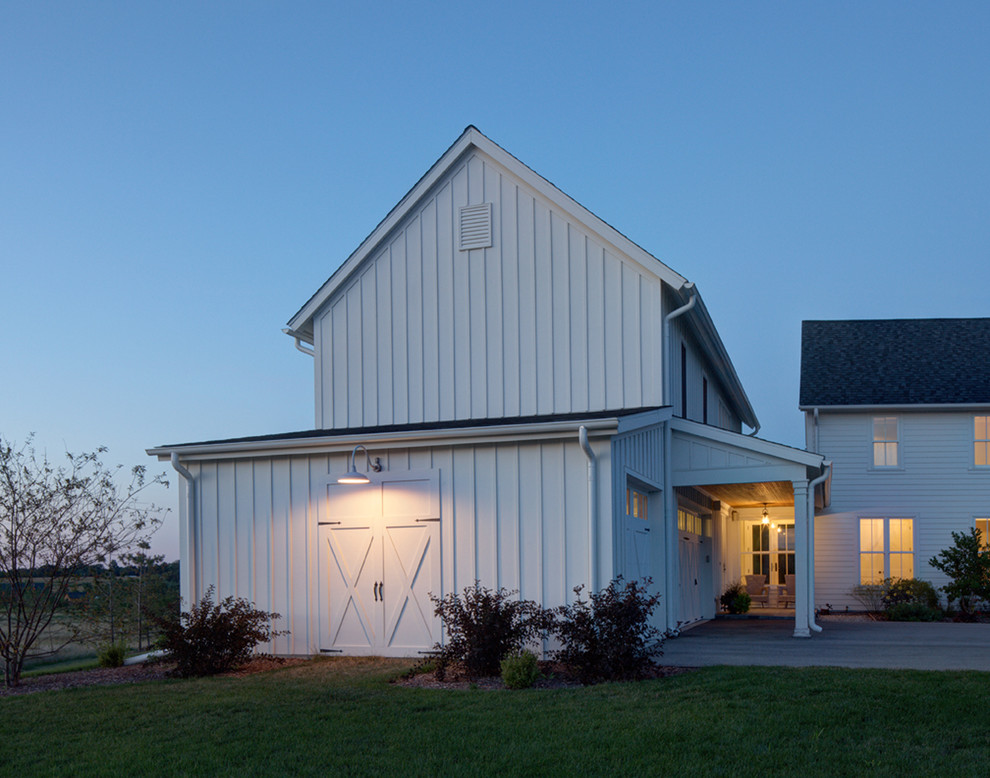 Inspiration for a mid-sized cottage white two-story concrete fiberboard exterior home remodel in Milwaukee