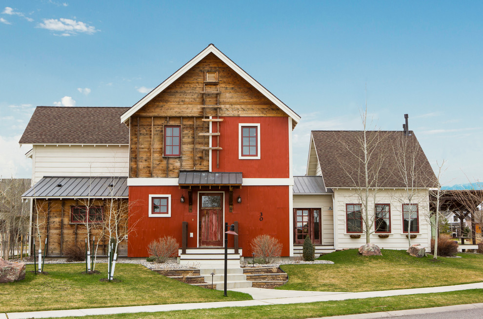 Cottage red two-story mixed siding gable roof photo in Other