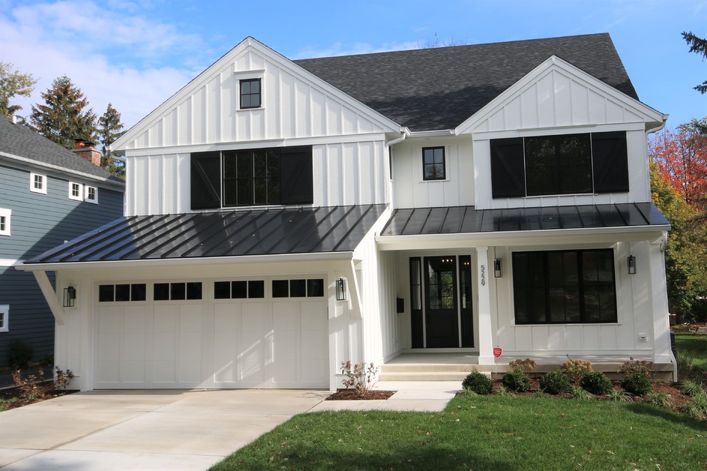 Large country white two-story wood exterior home photo in Chicago with a shingle roof