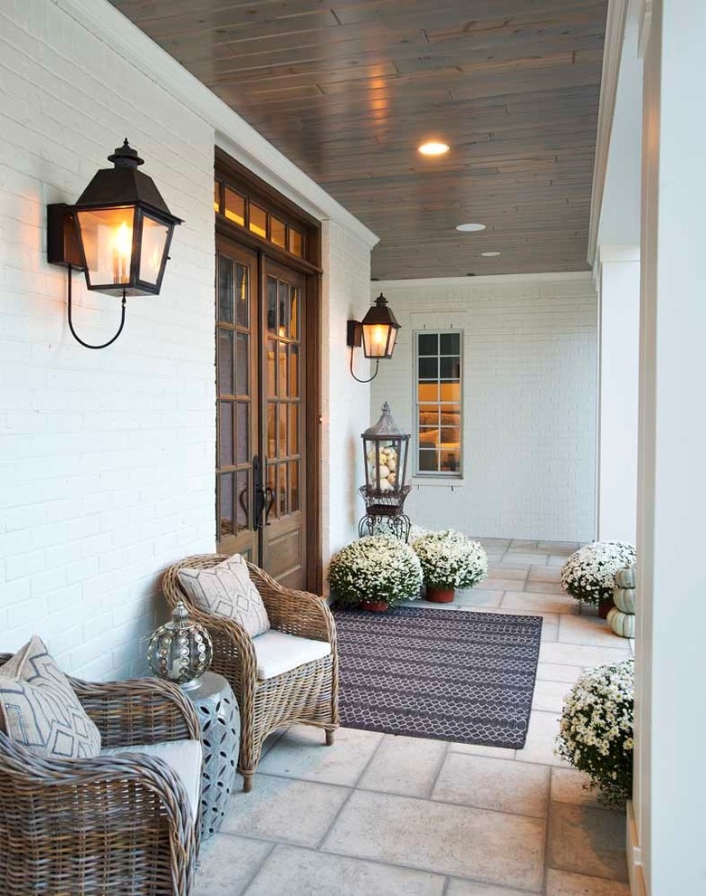 Inspiration for a large country white two-story brick exterior home remodel in Nashville