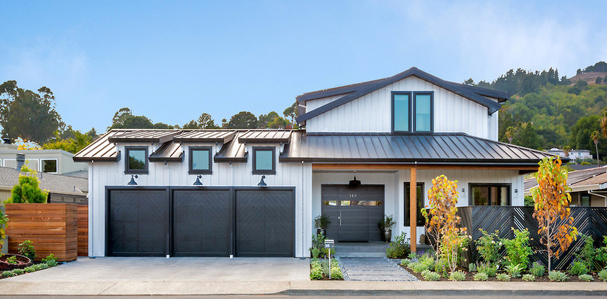 Large cottage white two-story concrete fiberboard gable roof photo in San Francisco
