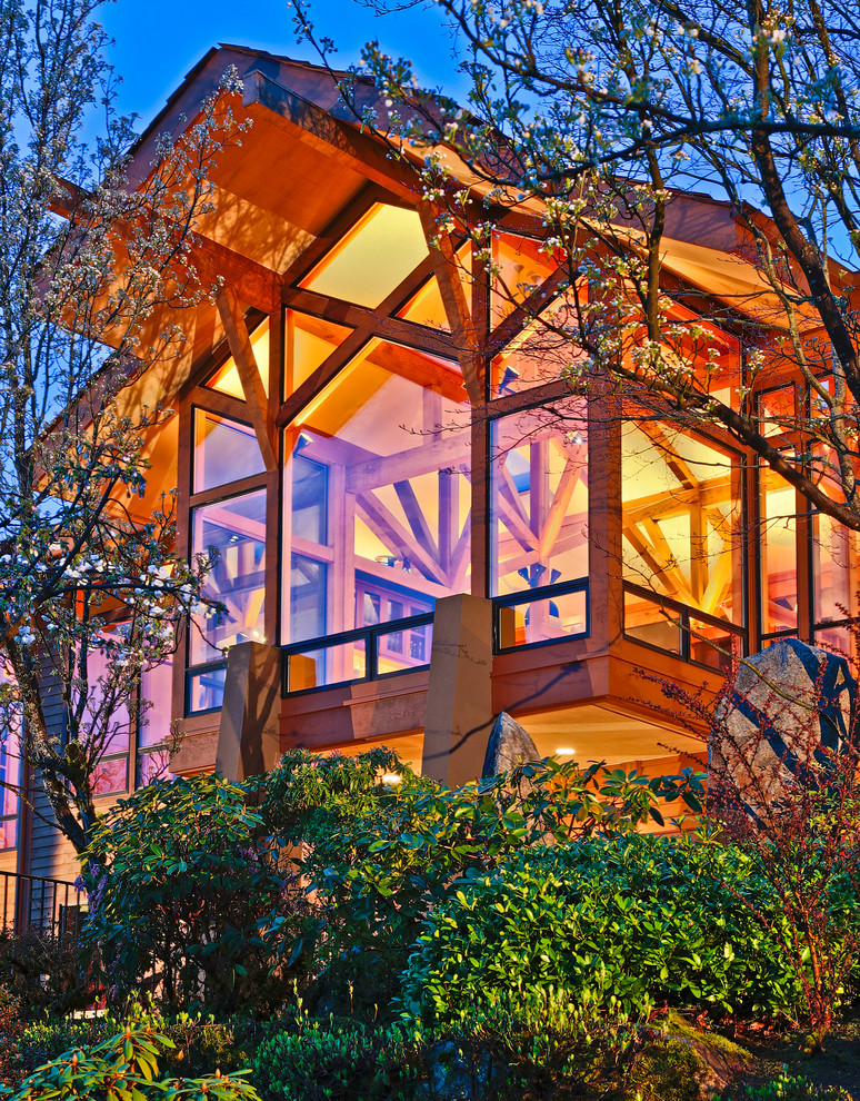 Design ideas for a contemporary house exterior in Seattle with wood cladding.