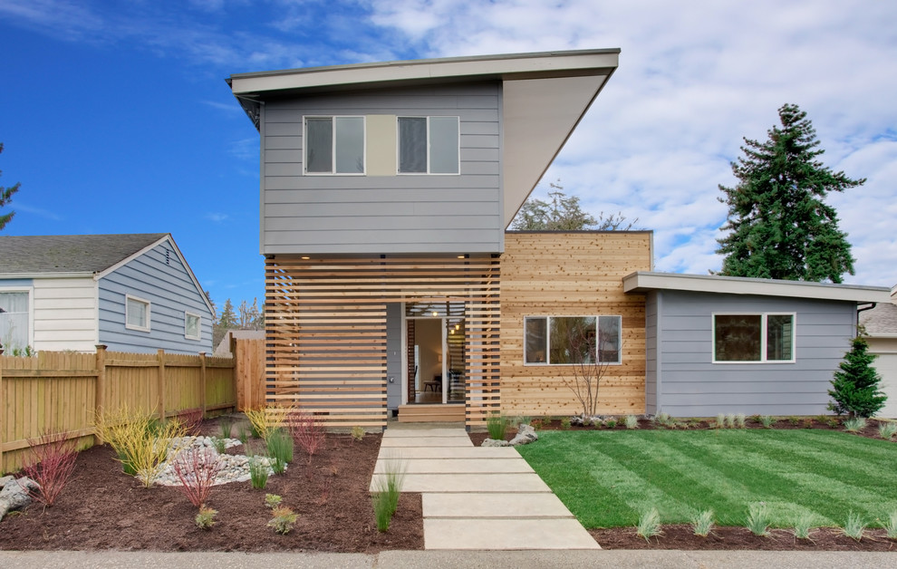 Contemporary wood exterior home idea in Seattle