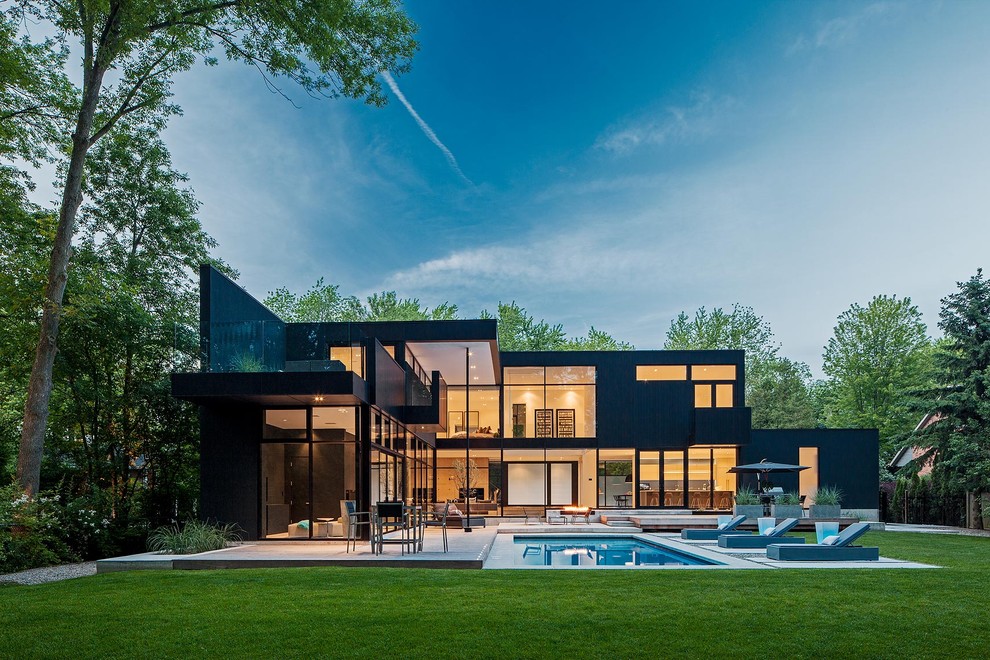 Large minimalist black two-story exterior home photo in Toronto