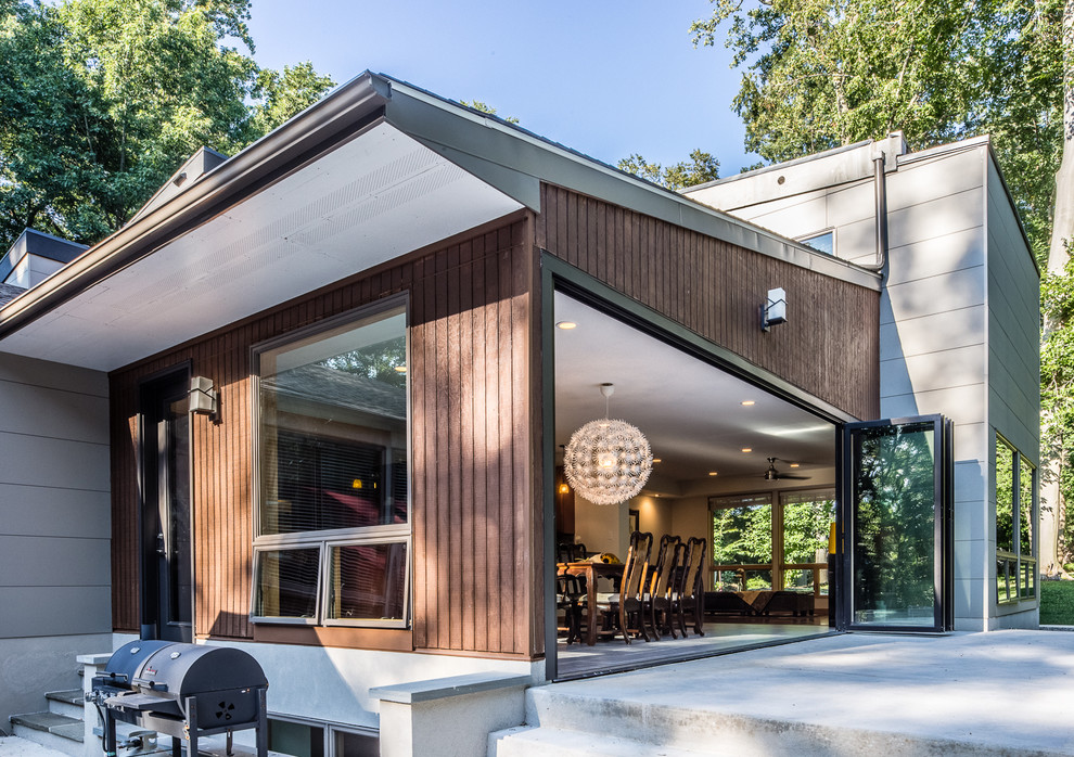 Inspiration for a large modern gray two-story exterior home remodel in Philadelphia with a shed roof