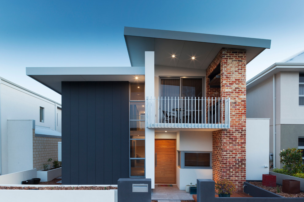 Inspiration for a contemporary house exterior in Perth with mixed cladding.