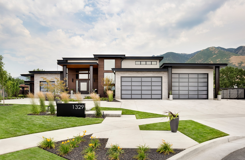 Example of a trendy one-story mixed siding exterior home design in Salt Lake City