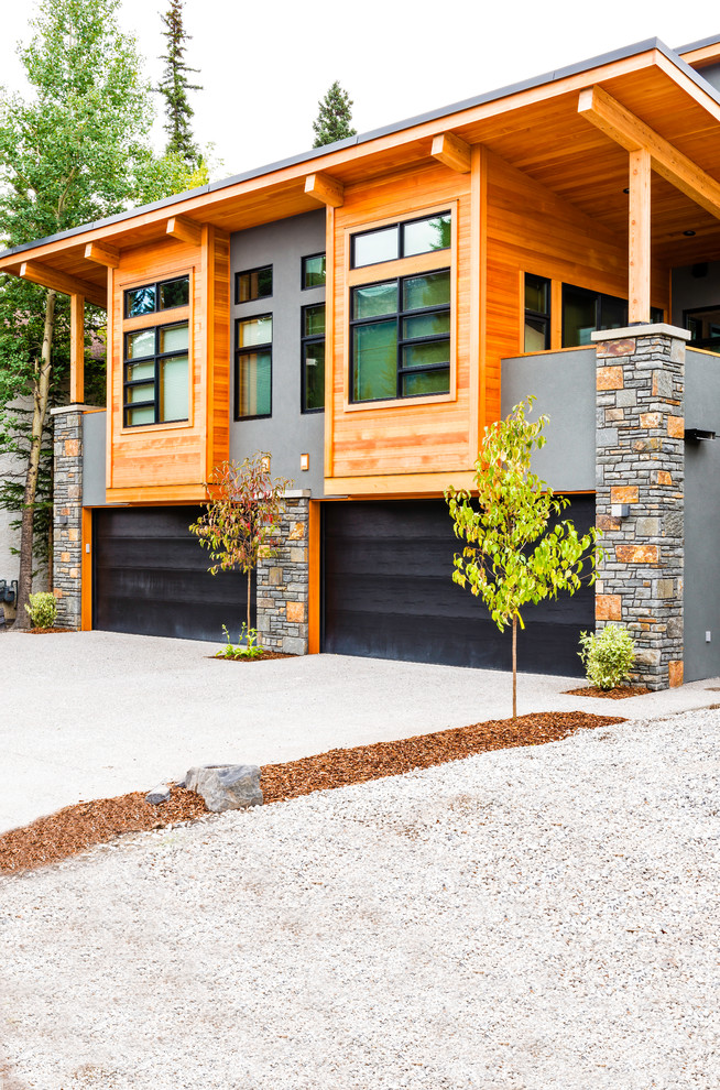 Inspiration for a large rustic duplex exterior remodel in Vancouver
