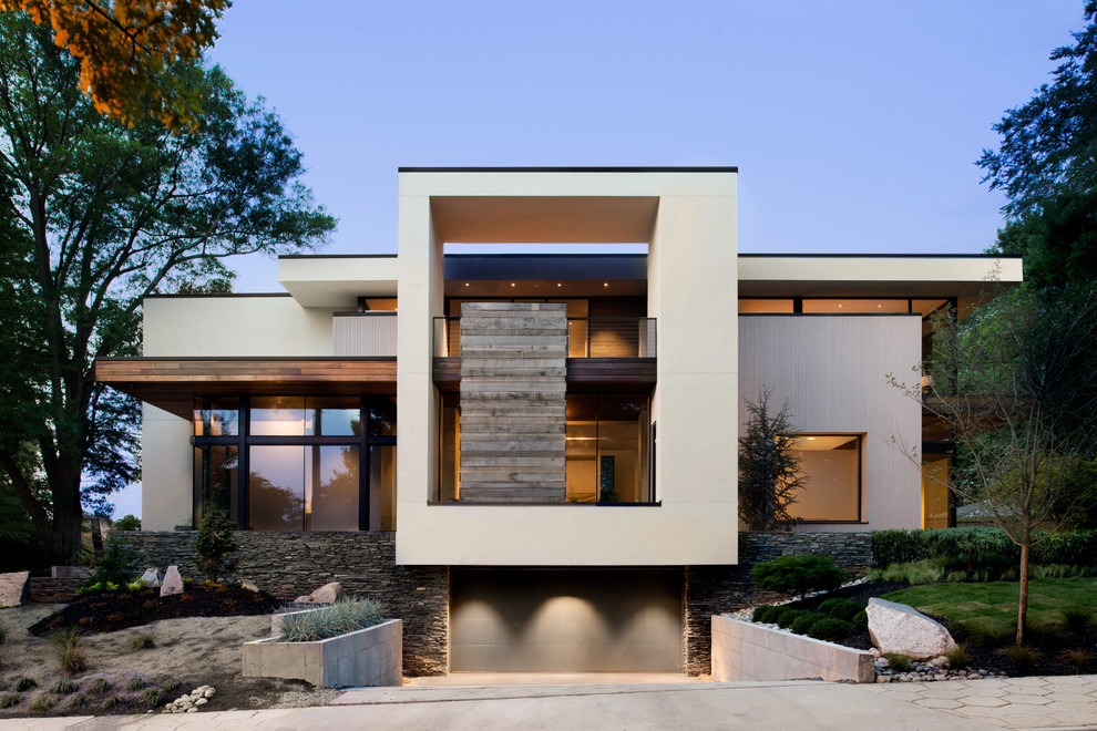 Large and white modern house exterior in Atlanta with three floors, mixed cladding and a flat roof.
