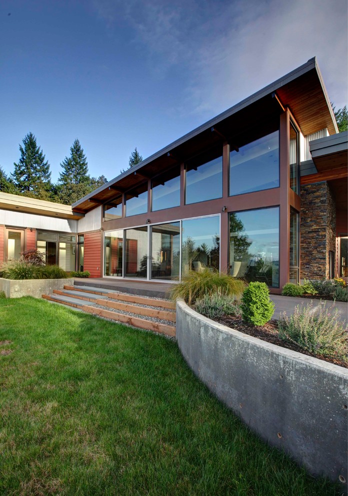 Trendy red one-story metal exterior home photo in Portland