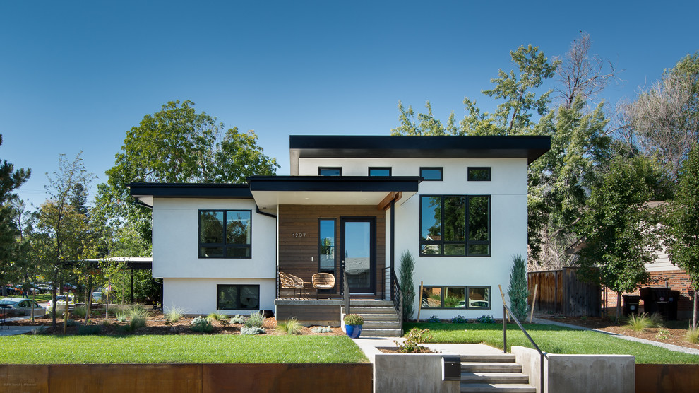 Minimalist white stucco exterior home photo in Denver