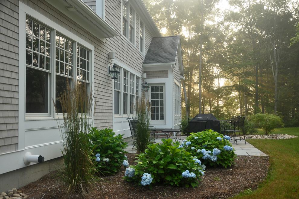 Mid-sized transitional gray two-story wood exterior home photo in New York with a shingle roof