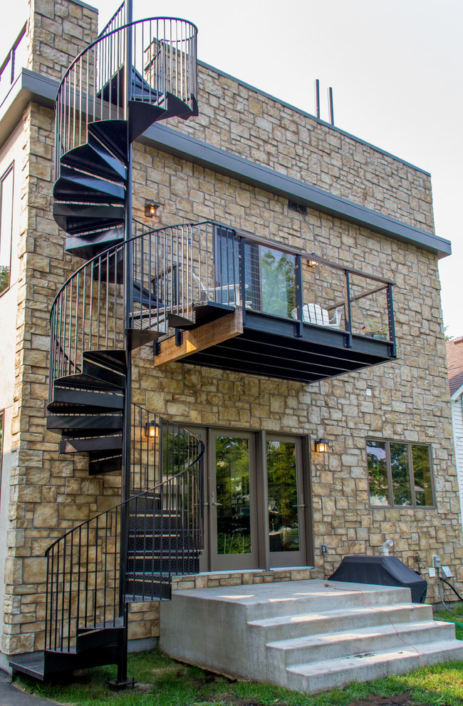 Photo of a medium sized and beige modern two floor house exterior in Minneapolis with mixed cladding.