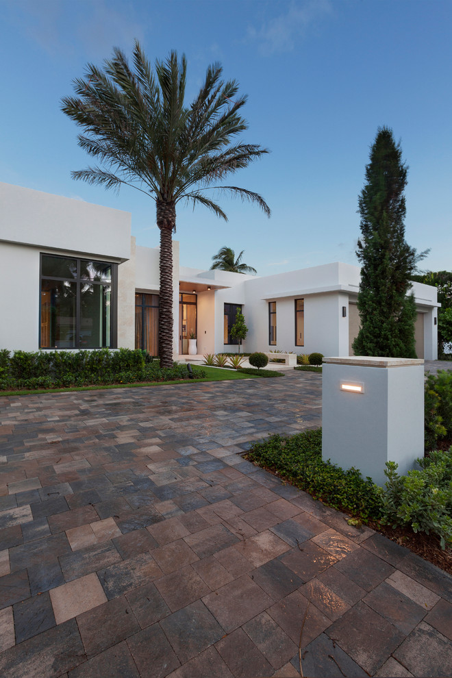 Large and white modern bungalow render house exterior in Miami with a flat roof.