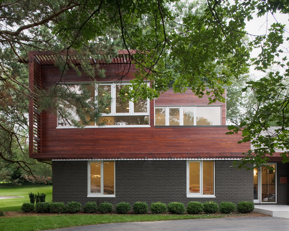 Idee per la facciata di una casa moderna con rivestimento in legno