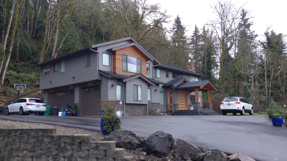Inspiration for a large contemporary brown two-story mixed siding exterior home remodel in Seattle with a shingle roof